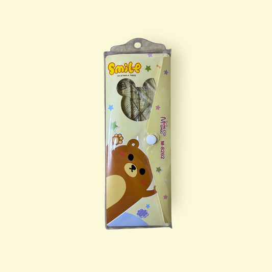Packaged product with a bear design on a beige background
