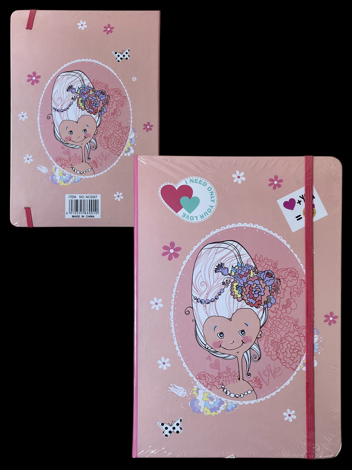Pink notebook with a decorative cover featuring a stylized face and floral elements on a black background.