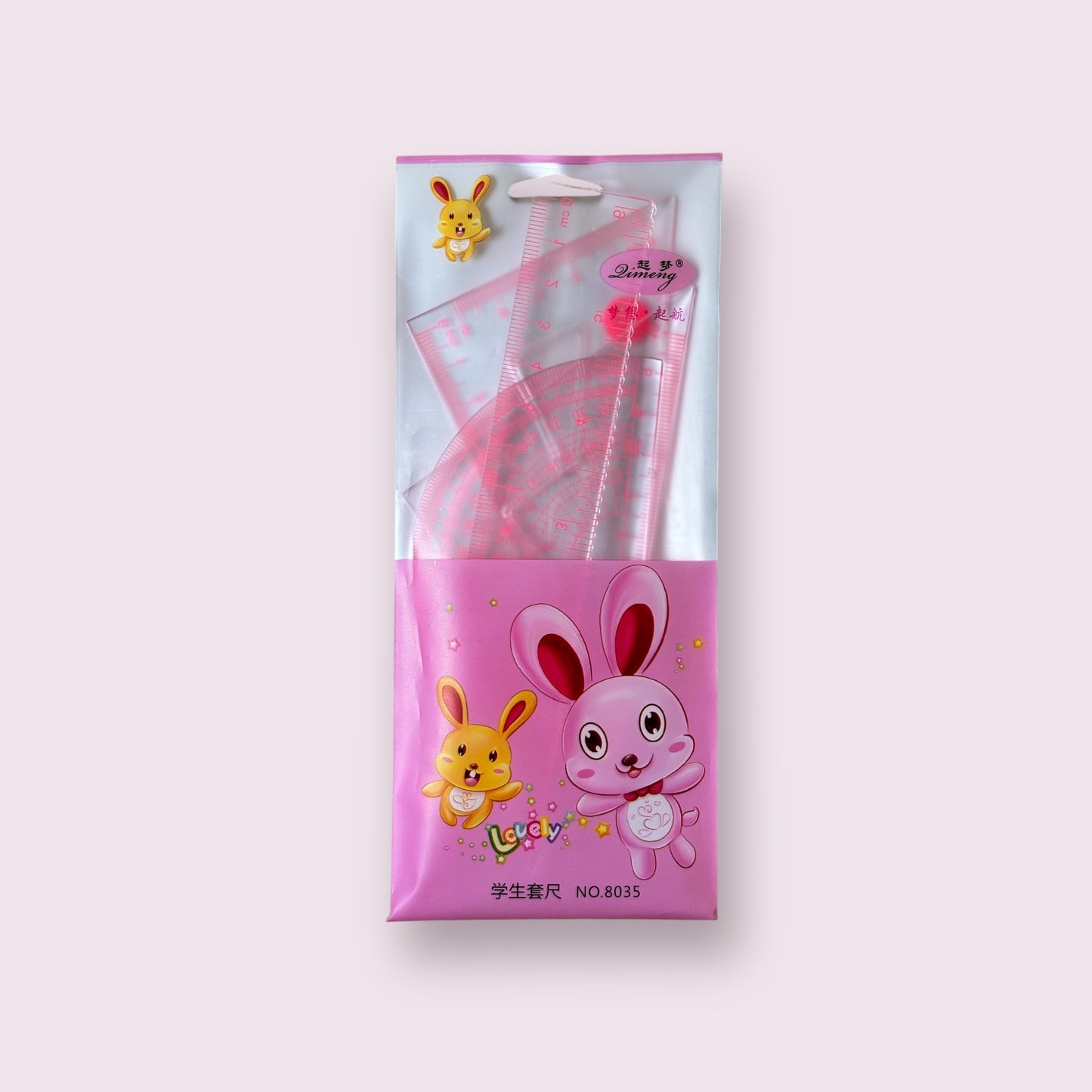 Pink packaging with cartoon characters containing stationery items on a white background