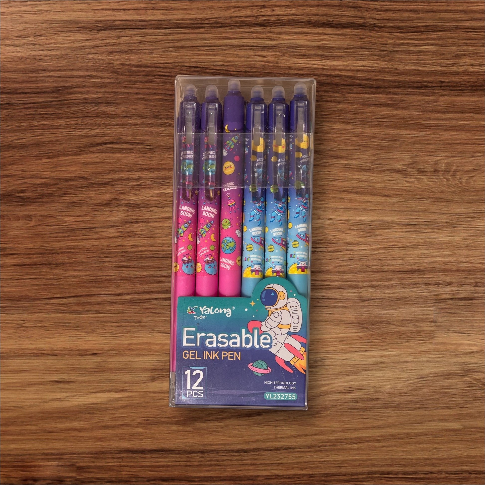 Pack of 12 erasable gel ink pens on a wooden surface